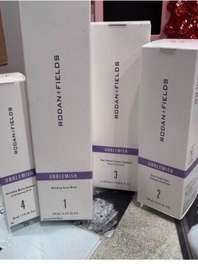 Rodan + Fields Unblemish Skincare Set in White with Purple Bands